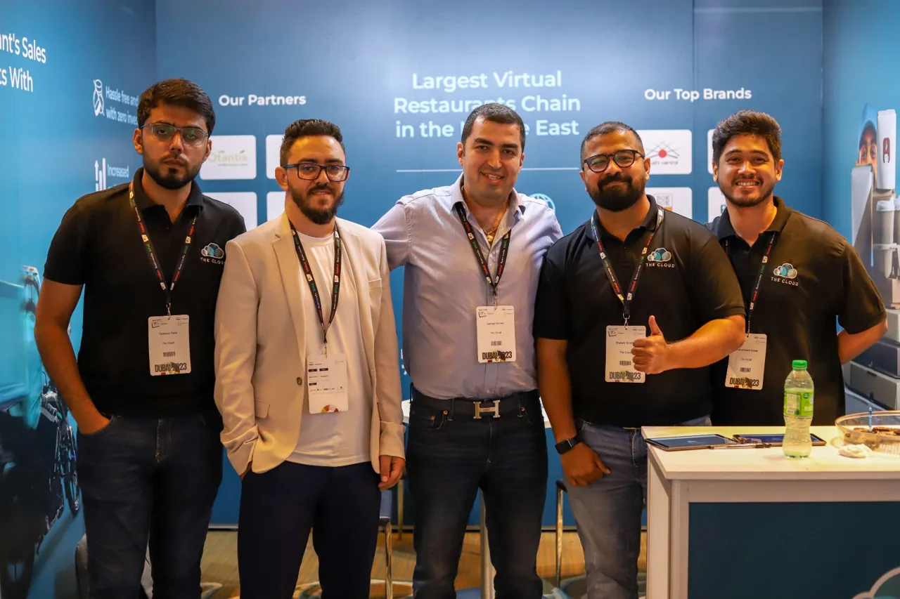 The Cloud team at their Fast Food & Café Convention booth, with co-founder and CEO George Karam in the middle